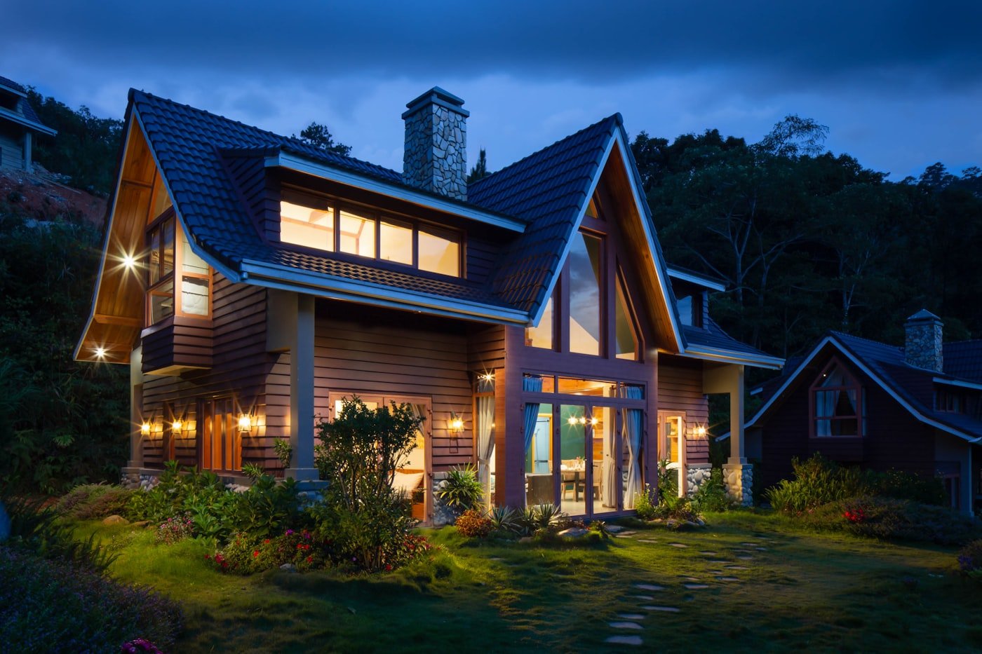 A warmly lit, energy-efficient Rugby home at dusk